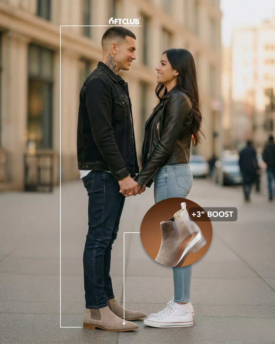 Man and woman holding hands on a city sidewalk, both wearing the taupe Westbridge Suede boots; a circular inset shows an X-ray view of the boot's sole labeled +3 inch boost
